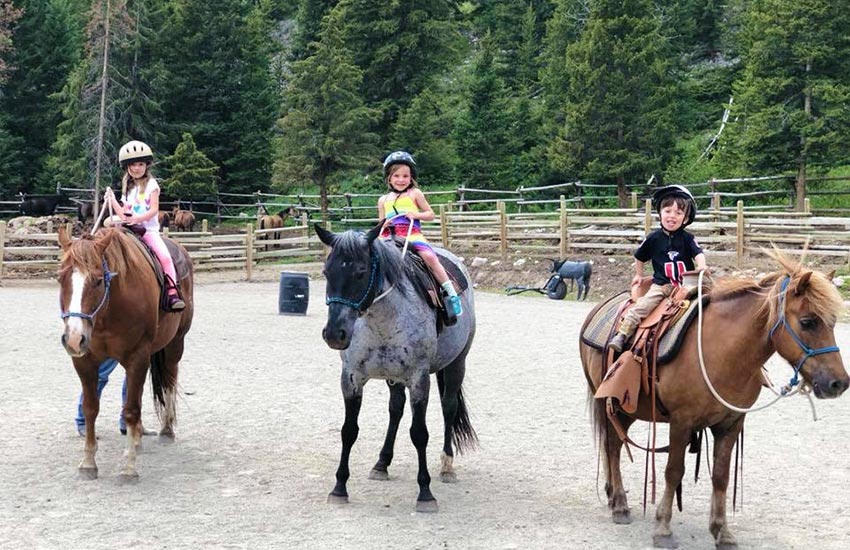3 kids on horseback