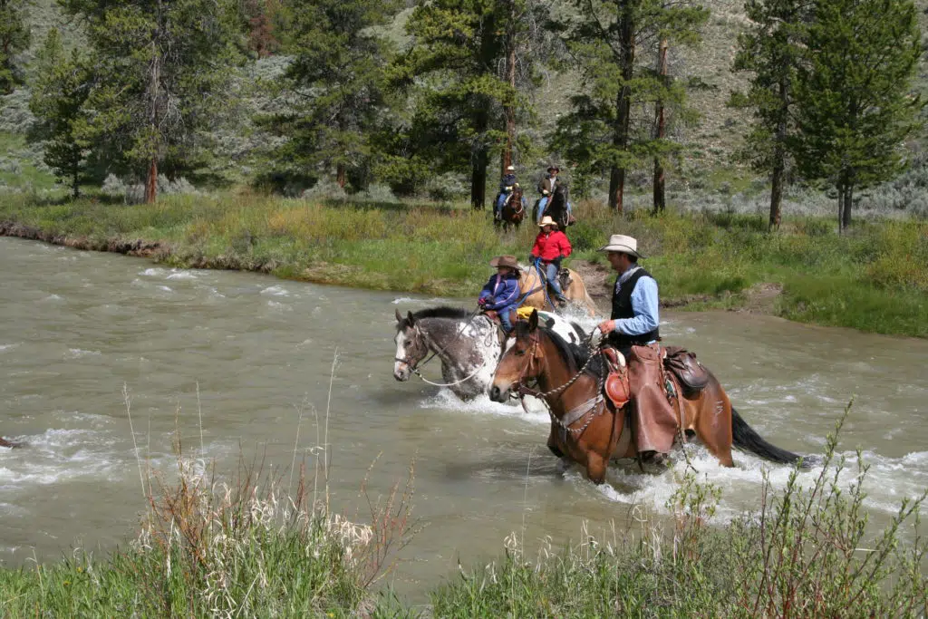 horseback through river
