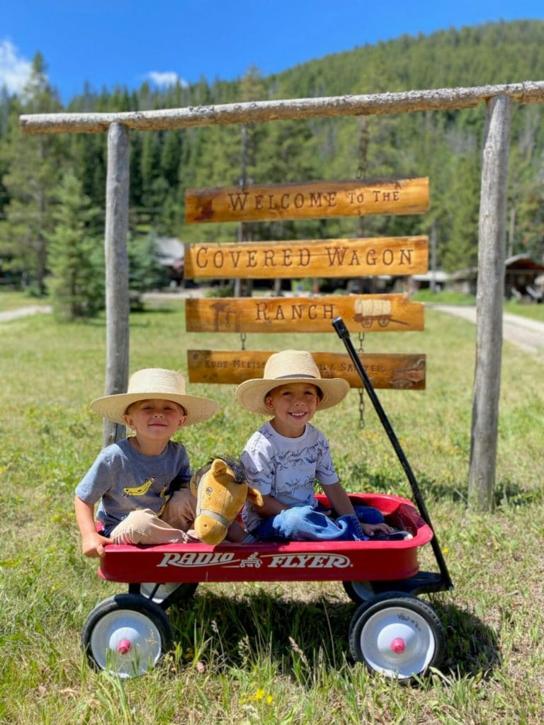 Kids in wagon at Covered Wagon Ranch