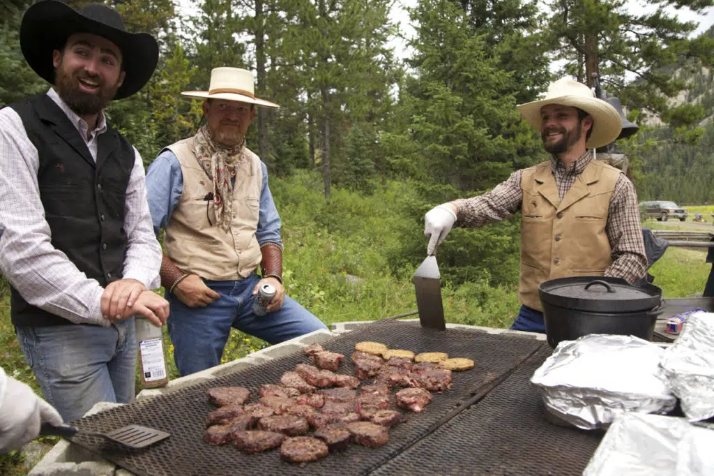 cowboys grilling steak