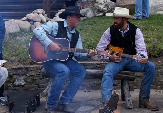 cowboys playing guitar